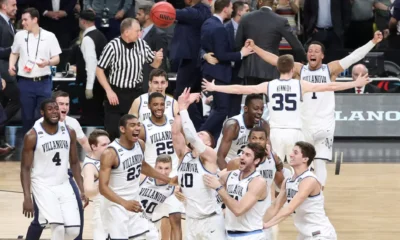Villanova alumnus Donte DiVincenzo celebrates with his teammates after winning the 2018 NCAA championship. Image courtesy of Villanova athletics.