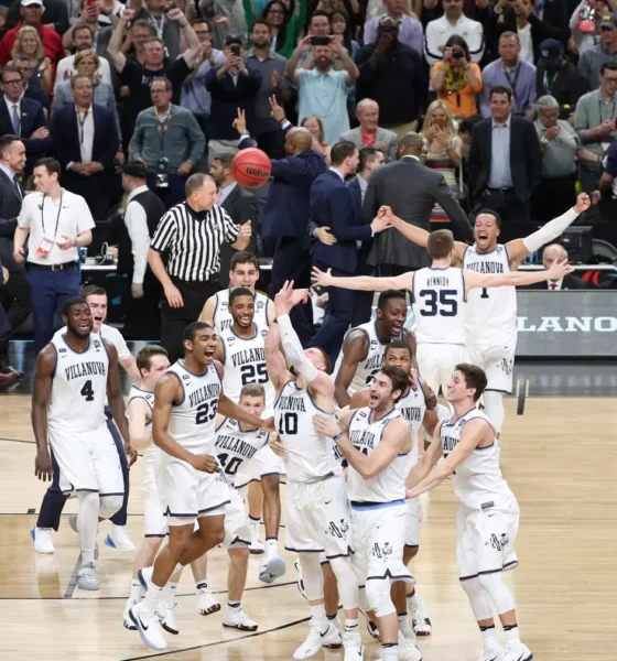 Villanova alumnus Donte DiVincenzo celebrates with his teammates after winning the 2018 NCAA championship. Image courtesy of Villanova athletics.