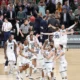 Villanova alumnus Donte DiVincenzo celebrates with his teammates after winning the 2018 NCAA championship. Image courtesy of Villanova athletics.