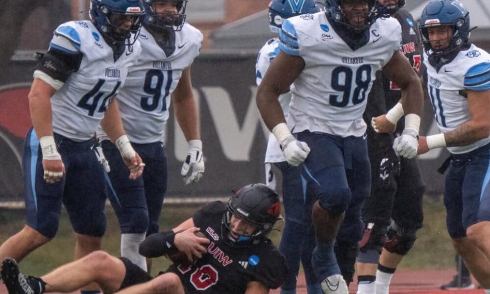 Villanova Football defensive tackle Obinna Nwobodo (98) flexes after a tackle. Image courtesy of Obinna Nwobodo's Instagram account.
