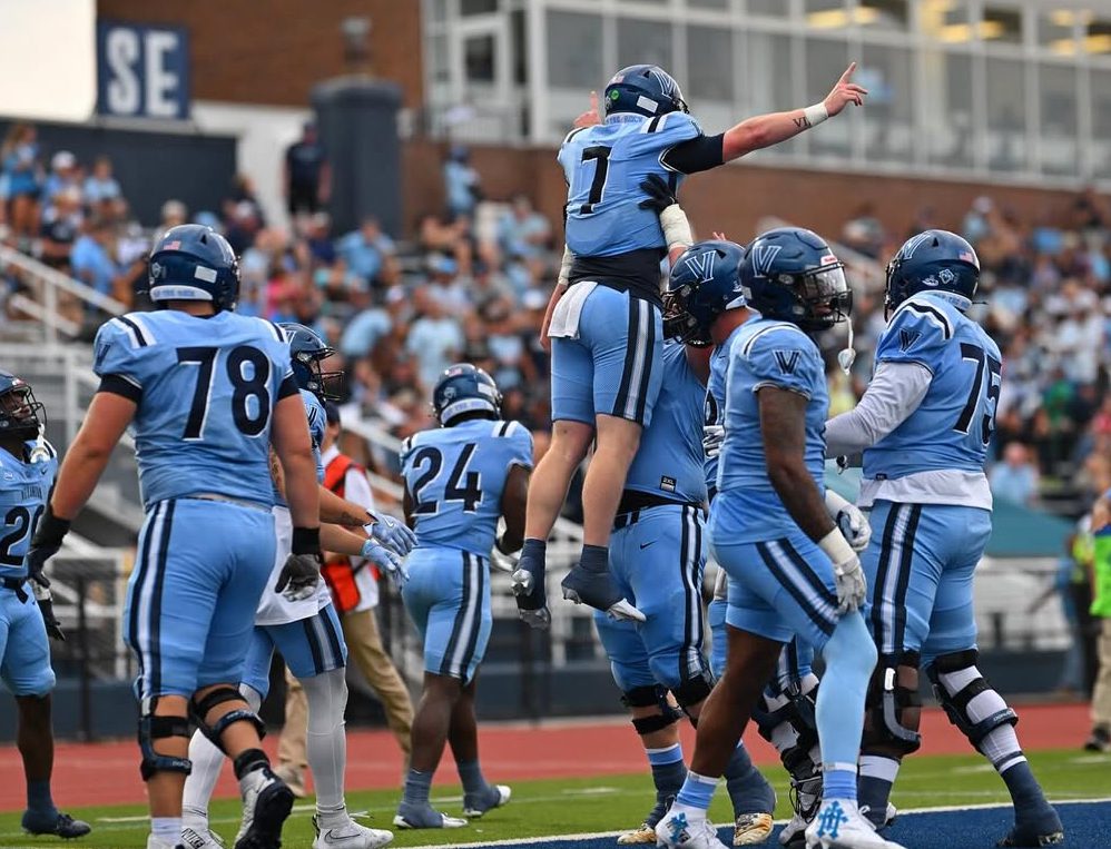 Villanova quarterback Pat McQuaide celebrates a touchdown run with his offensive line in the first half of the Wildcats' Sept. 6 win over Colgate. Image courtesy of Villanova Football's Instagram account.