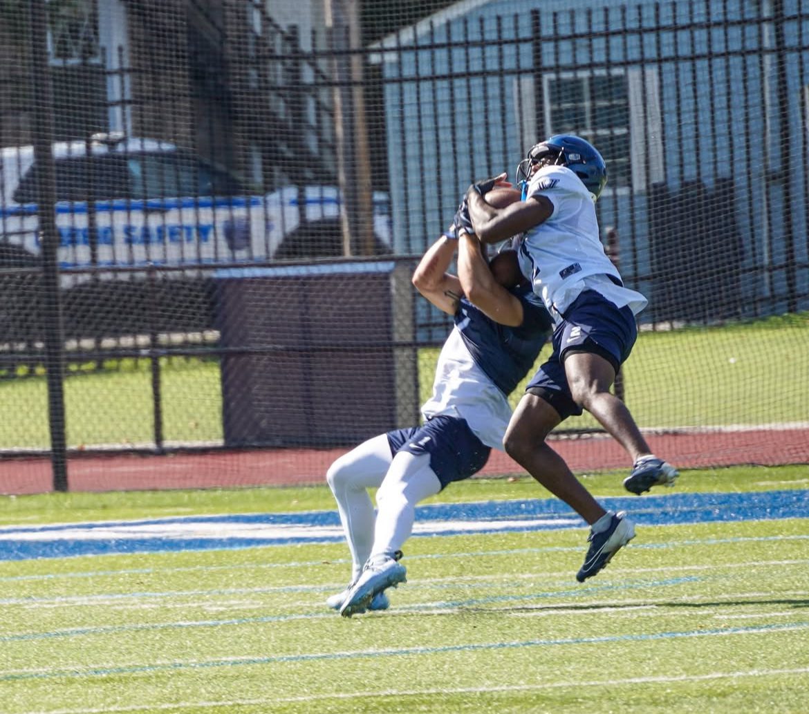 Villanova Football cornerback Zahmir Dawud (2) fights for the ball in summer practices. Image courtesy of Nova Football Recruiting.