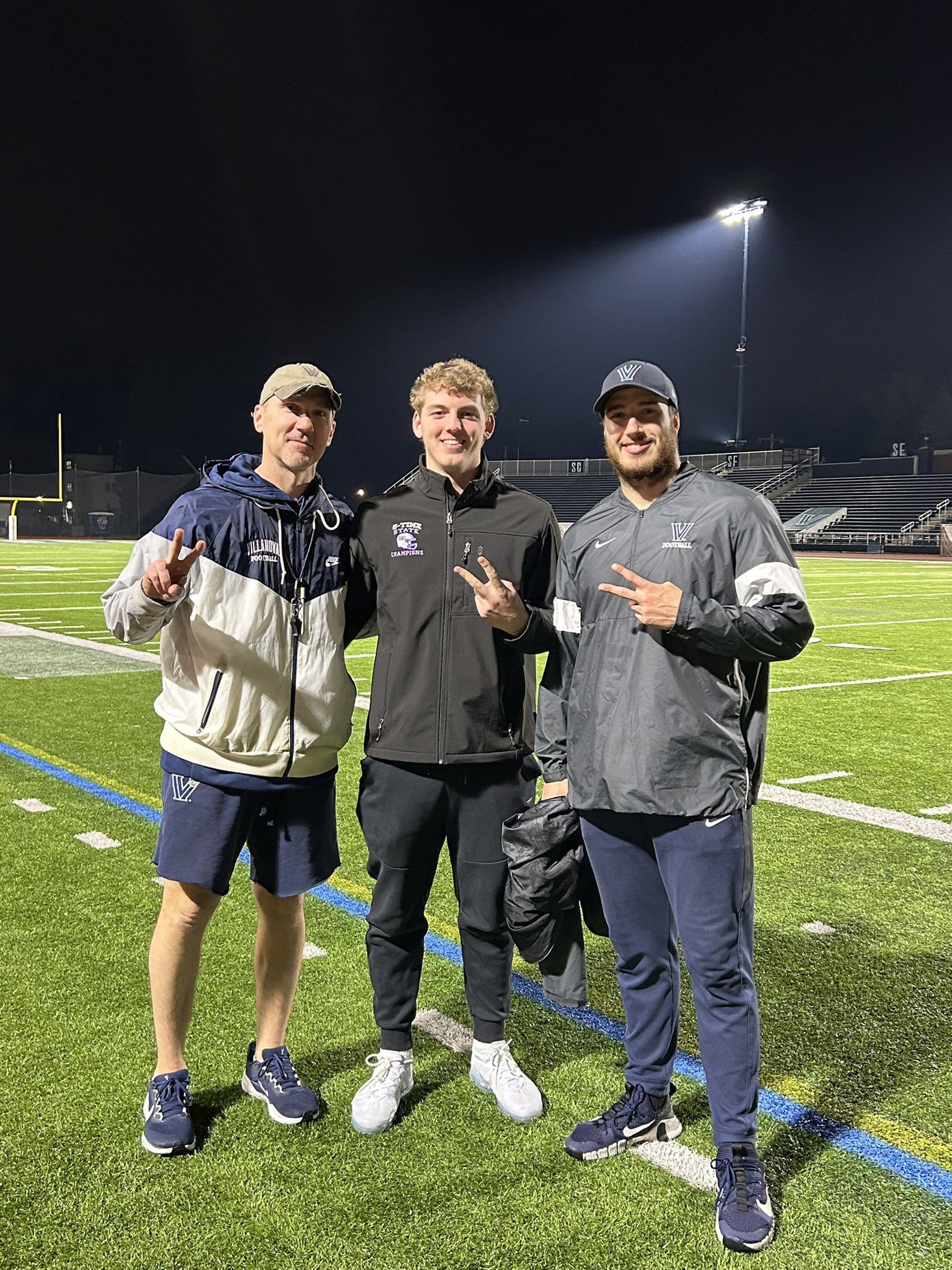 Villanova Football commit Jake Kissell poses with the Wildcats' coaching staff. Image courtesy of Jake Kissell's Instagram account.