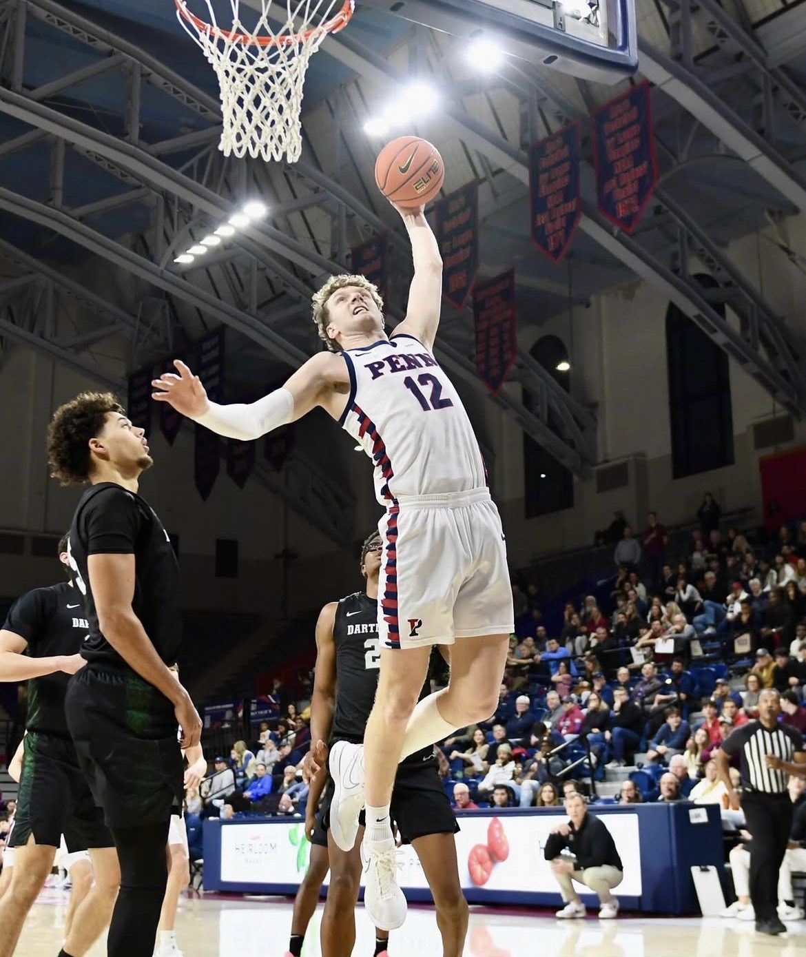 Penn Forward TJ Power catches air in the first half of the Quakers’ Feb. 27 win over Dartmouth. Image courtesy of Penn Men’s Basketball’s Instagram account.