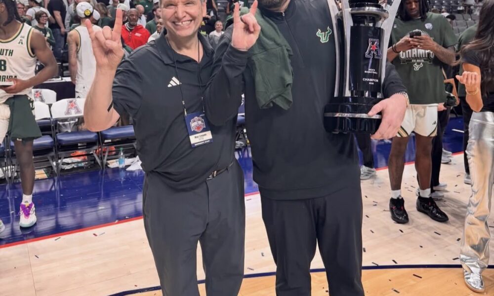 New Providence head coach Bryan Hodgson poses after winning the American with USF. Image courtesy of usf_pres' Instagram account.
