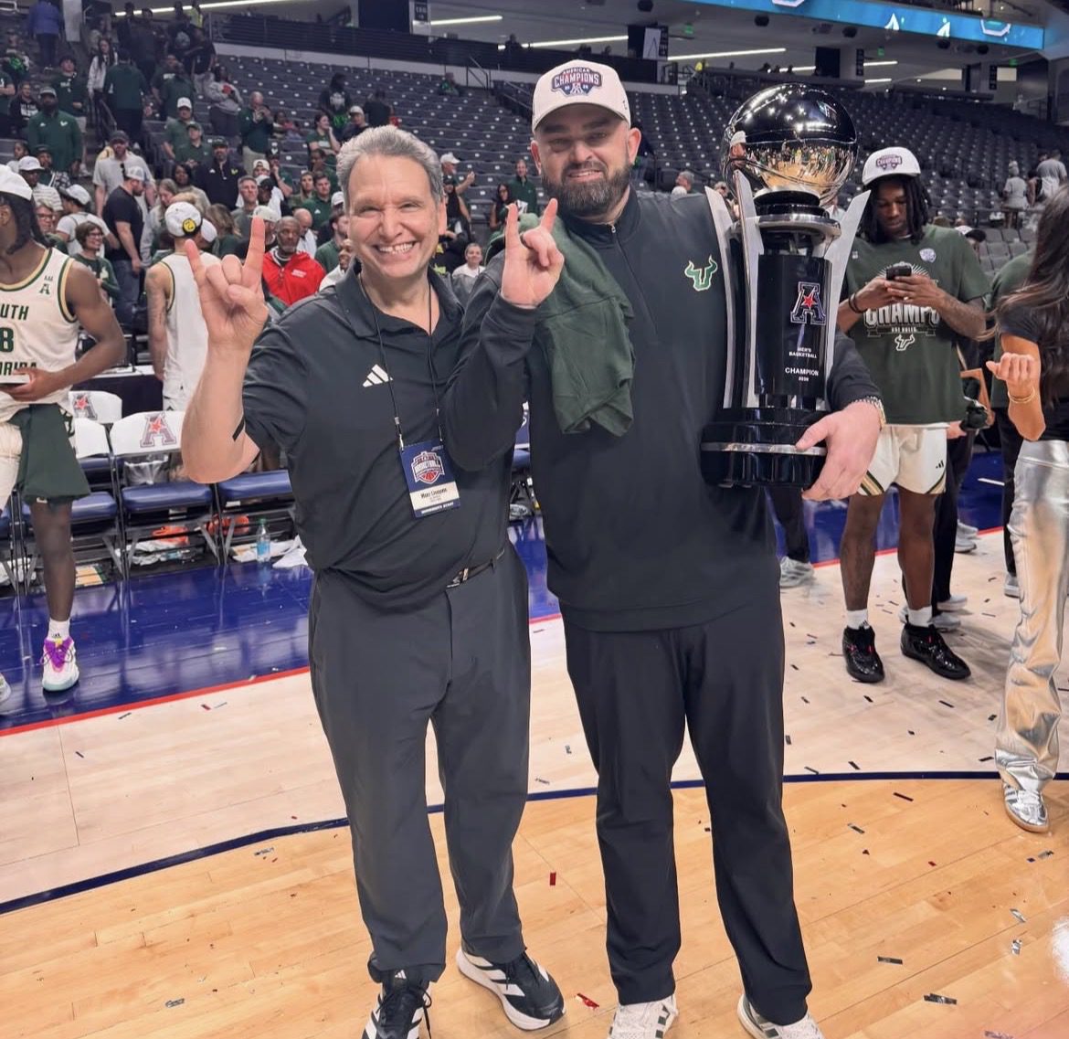 New Providence head coach Bryan Hodgson poses after winning the American with USF. Image courtesy of usf_pres' Instagram account.