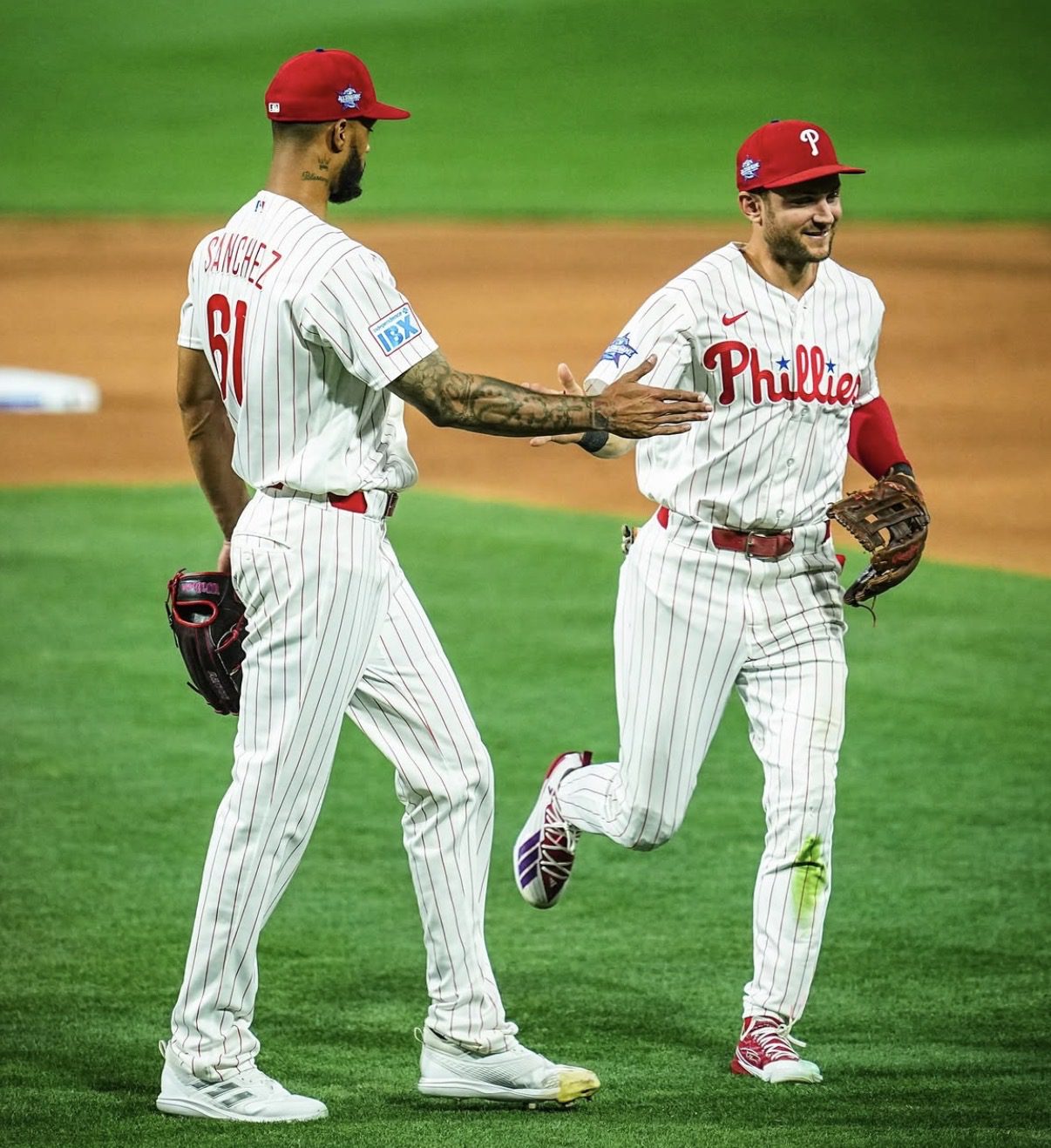 Phillies' left-handed starter Cristopher Sánchez high-fives shortstop Trea Turner. Image courtesy of Phillies' Instagram account.