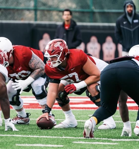 Temple Football center Grayson Mains prepares to snap the ball in practice. Image courtesy of Grayson Mains' Instagram account