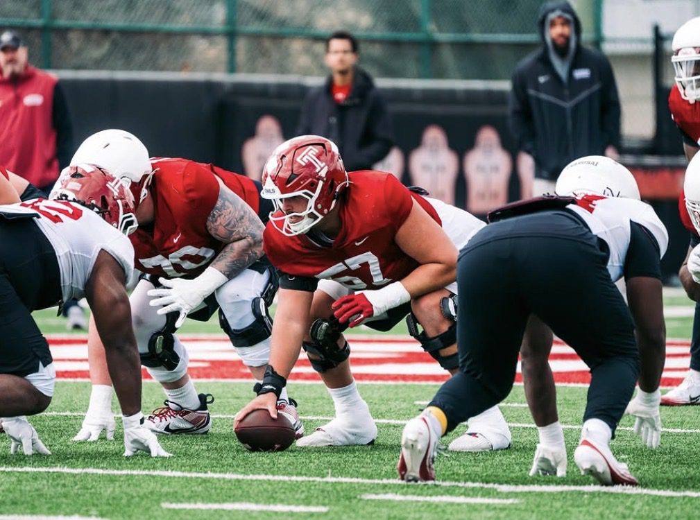 Temple Football center Grayson Mains prepares to snap the ball in practice. Image courtesy of Grayson Mains' Instagram account
